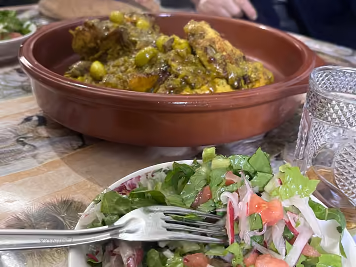 Chicken tagine with olives served at the family table