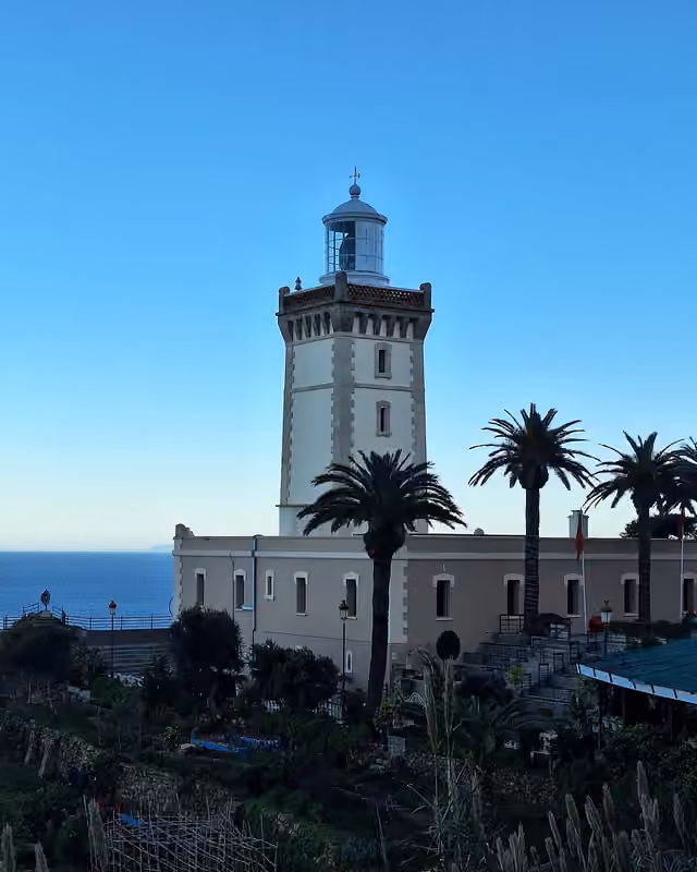 Cap Spartel lighthouse and palms in the evening light